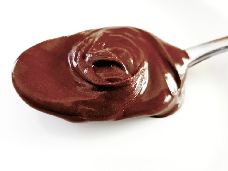 Once Again Nut Butter Amoré Hazelnut Spread on a spoon. See the treats you can make with this delicious hazelnut spread. DearCreatives.com