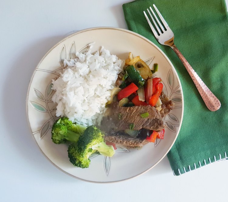 Beef stir fry just plated and ready to eat. Grab the beef stir fry recipe at DearCreatives.com