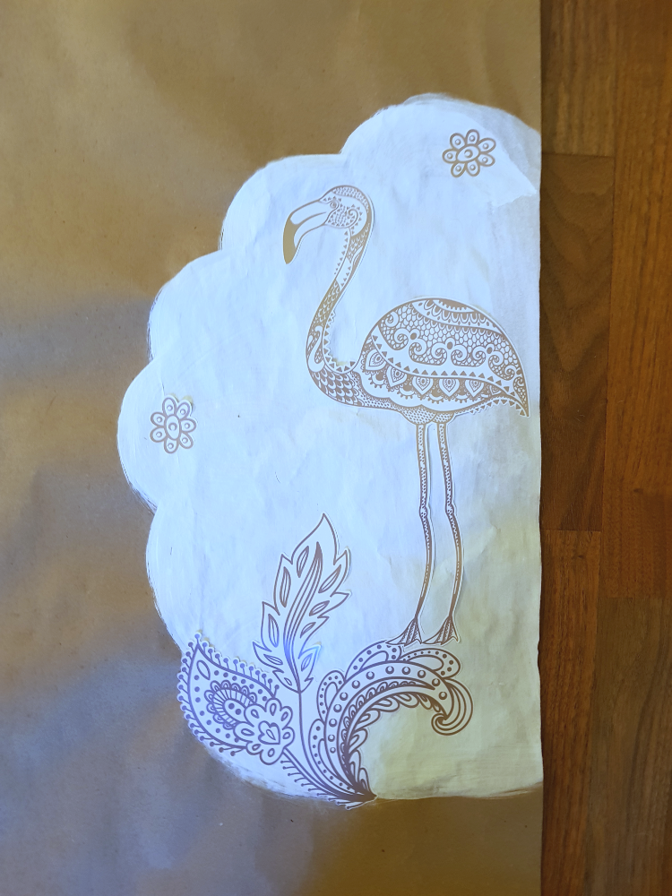 Close up of bottom of the photo prop design. Pillow-y clouds painted white with floral, boho, and flamigo decals added. See diy photo prop at DearCreatives.com