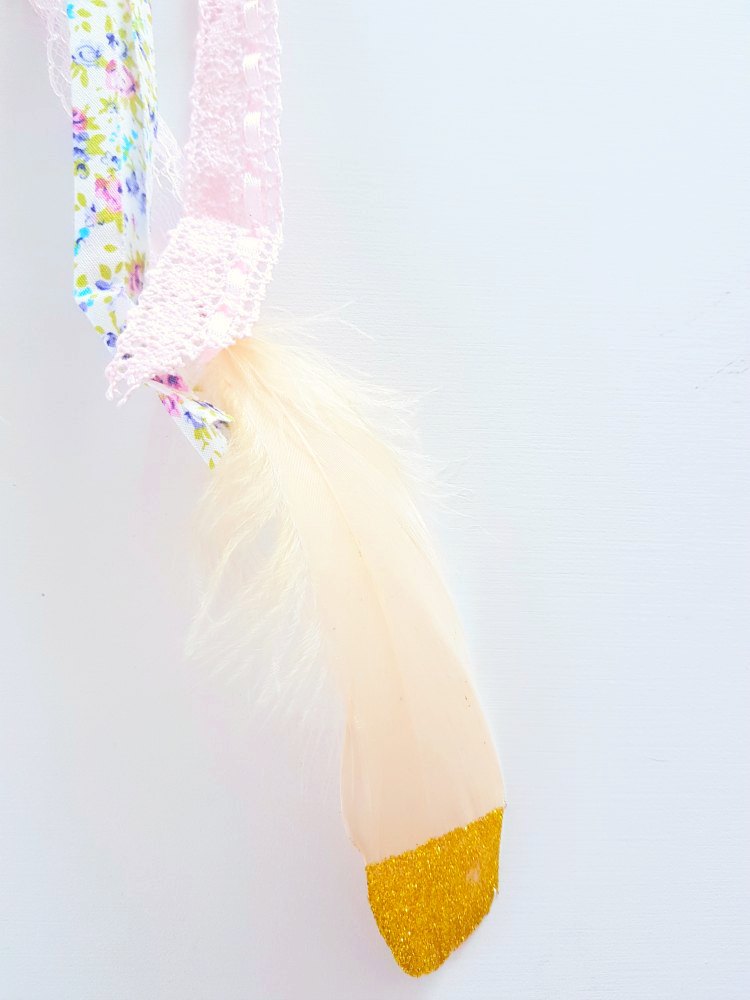 Feathers for a diy dream catcher tied to ribbon how to at DearCreatives.com