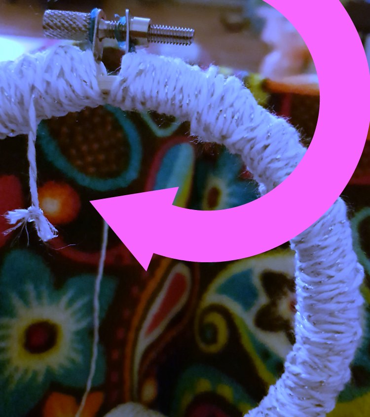 Step for how to tie off, and tuck in knot for on a dreamcatcher DIY at DearCreatives.com