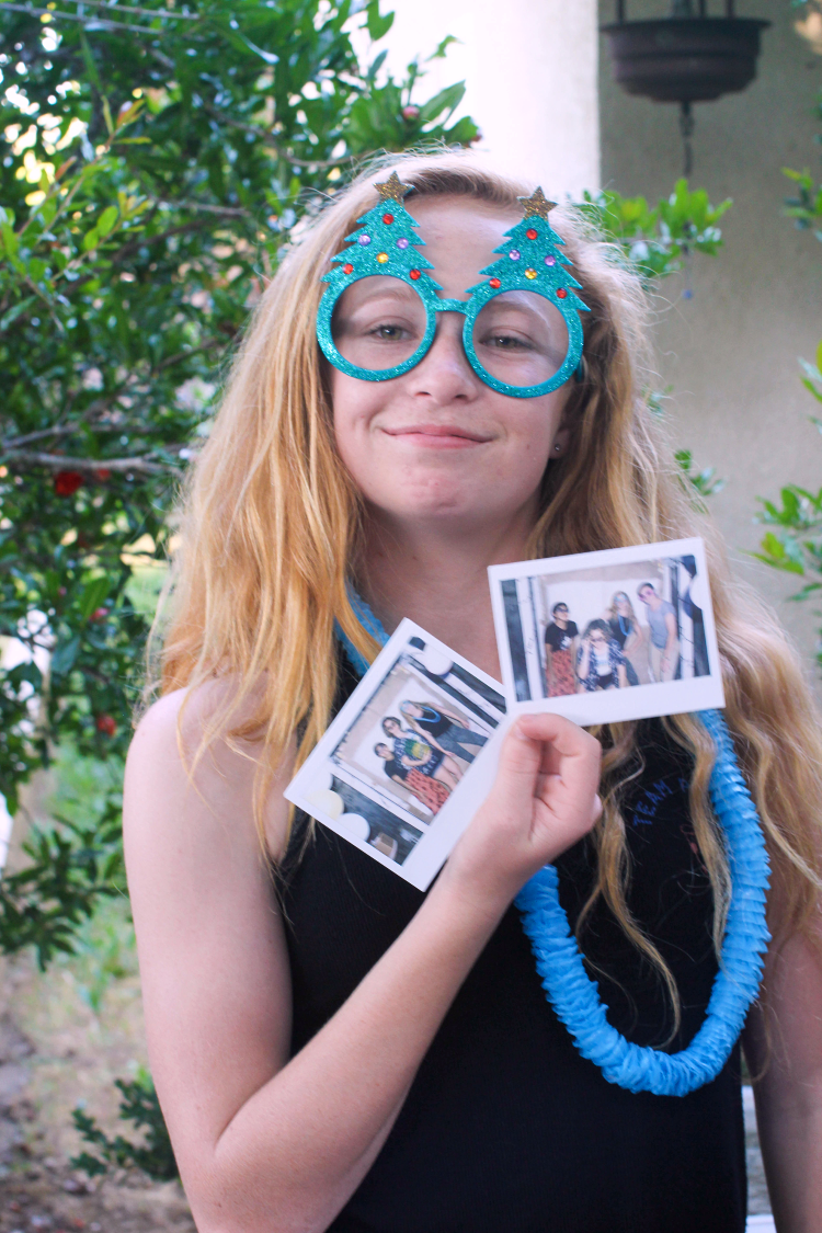 Sweet 16 Party Photo Booth Photos Teen holding Polaroid Photos Taken in photo booth © 2018 Theresa Huse