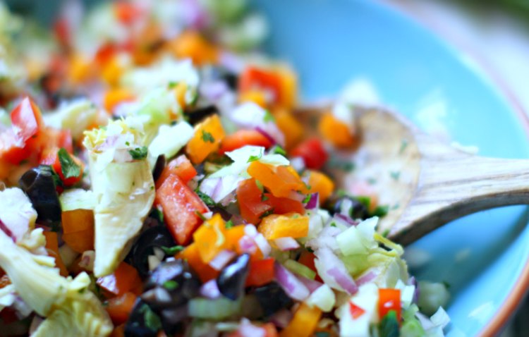 Mixing pasta salad with fresh chopped vegetables for a pasta salad recipe © 2018 DearCreatives.com