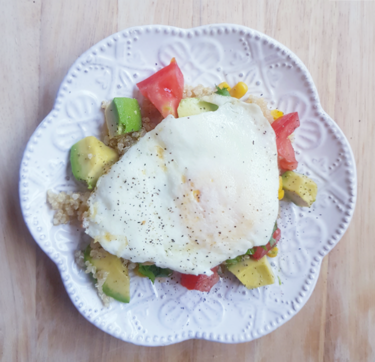 Quiona, corn, tomatoes, avocados, green onion, cilantro, topped with an egg for a breakfast bowl. DearCreatives.com