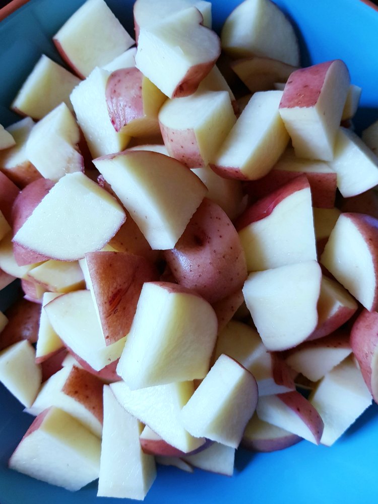 potatoes cut up and ready to be put into a potato soup recipe DearCreatives.com