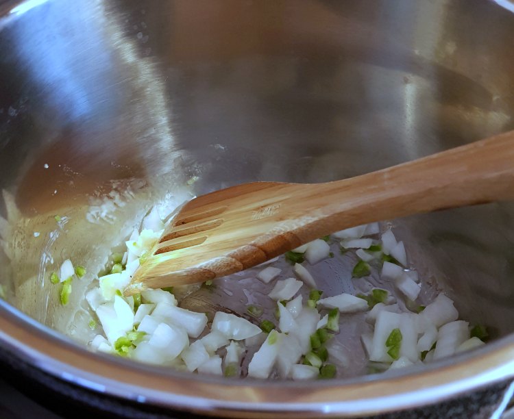 sauteing onions, garlic and jalapeno for a potato corn chowder recipe DearCreatives.com