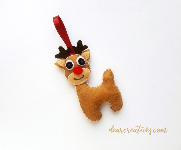 step (15) after head and neck are stitched together make a tiny knot....See full diy felt reindeer ornament at DearCreatives.com