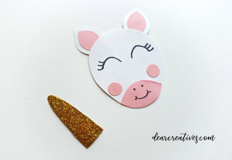unicorn ornament step (4) see how to make these easy paper unicorn ornaments to hang for decorations. DearCreatives.com #unicorn #ornaments #papercraft #diy #crafts 