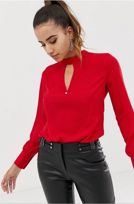 front plunge red shirt paired with leather pants