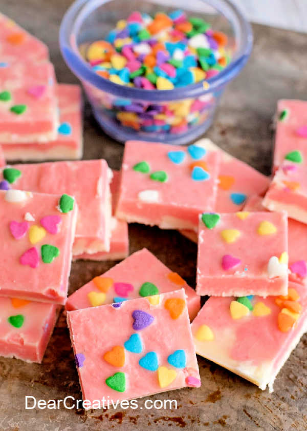 fudge with candy sprinkles , the candy sprinkles are optional and can be made with any type of candy sprinkle for your celebrations - how to make strawberry fudge DearCreatives.com #strawberry #fudge #marbled #candymaking #eastercandy #valentinesday #celebrations #homemadefudge #homemadecandy #recipe #easy 