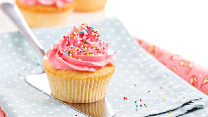 Cupcakes with pink frosting and colorful sprinkles
