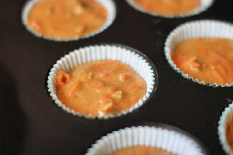 carrot cake cupcakes in a cupcake pan ready to be baked. Recipe at DearCreatives.com