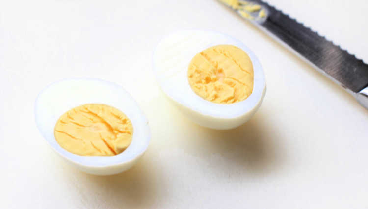 a hard boiled egg cut in half © 2019 DearCreatives.com