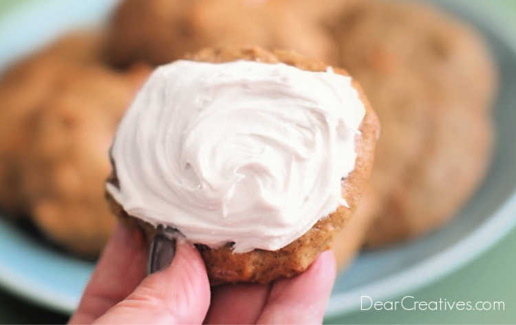 holding a frosted carrot cake cookie Grab the recipe at - DearCreatives.com