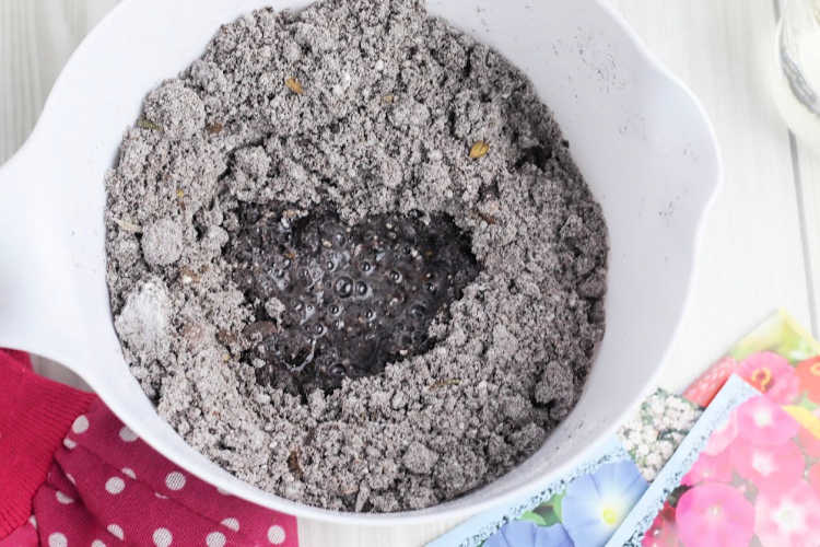 Dirt, seeds, water for shaping seed bombs with your hands. Find the step by step tutorial with images at DearCreatives.com