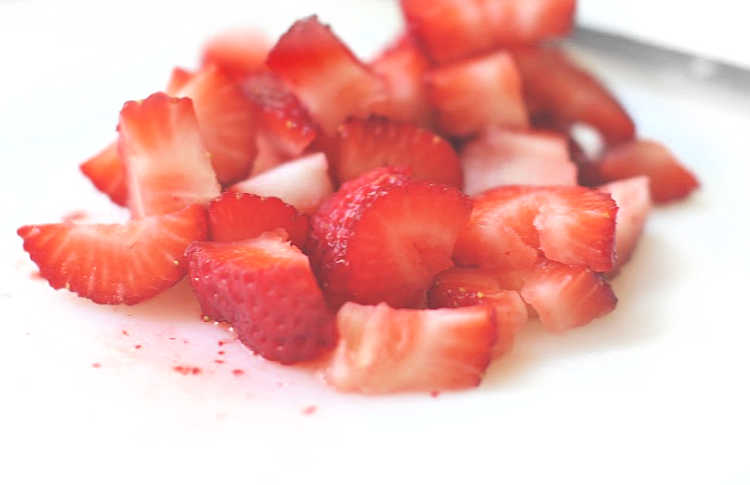 sliced strawberries on a cutting board DearCreatives.com