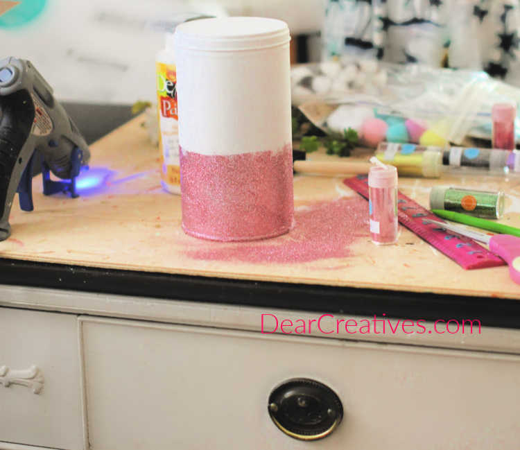 Glittering a can for unicorn room decor for a girls room. Girly unicorn decor instructions and unicorn ideas at DearCreatives.com