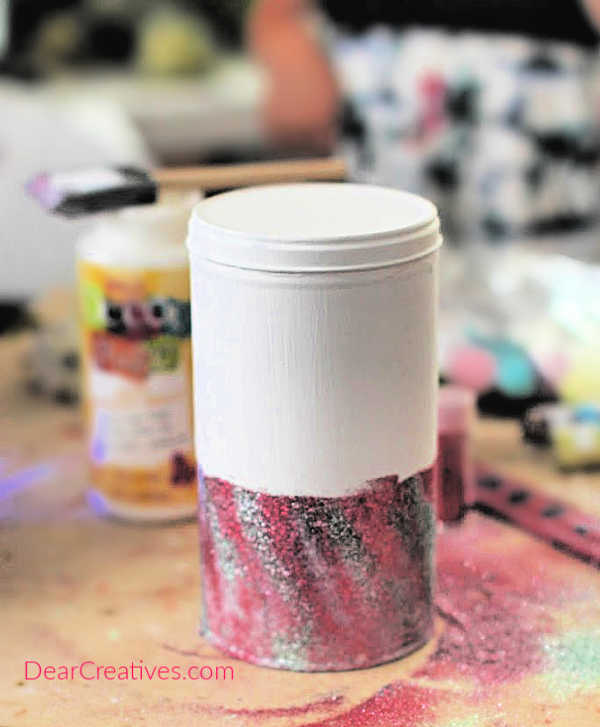 Second layer of glitter on can for unicorn room decor. See all steps and finished unicorn decor at DearCreatives.com