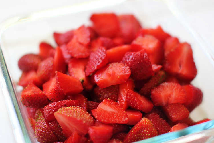 Strawberries washed, hulled and cut up for a summer strawberry dessert recipe. Strawberry Bars DearCreatives.com