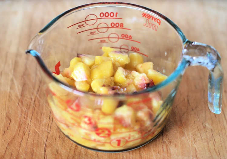 peaches cut up in a measuring cup © 2019 DearCreatives.com