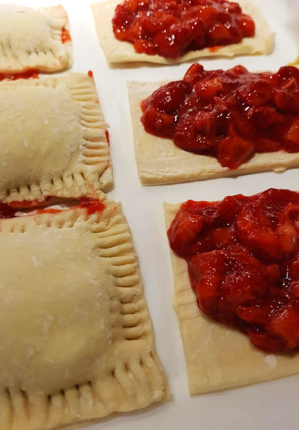 Strawberry Tarts being assembled. Grab the tart recipe at DearCreatives.com