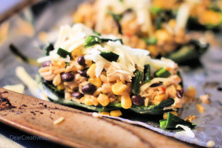 Stuffed Poblano Peppers ready to be cooked on a sheet pan in the oven. Grab the recipe for stuffed peppers at © 2019 DearCreatives.com