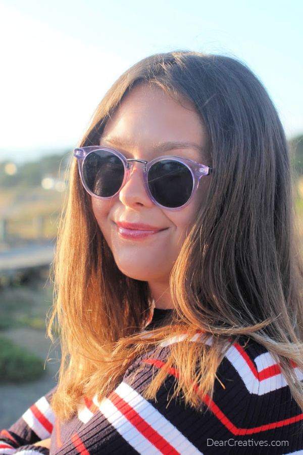 young lady wearing trendy sunglasses DearCreatives.com