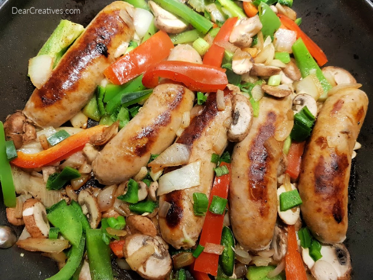 Close of of Chicken Sausage Cooking - Healthy, 30-minute meal. Grab the recipe for sausage and peppers at DearCreatives.com