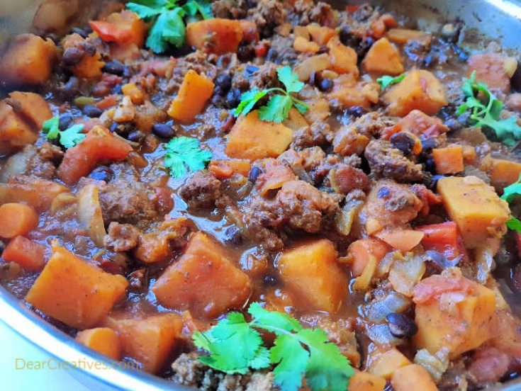 Chili with squash - butternut squash, black beans, ground beef. Cooked in 1 hour this makes an easy dinner for a crowd. This is perfect for a smaller family too as you can eat the left overs or even freeze the left overs to eat later. DearCreatives.com