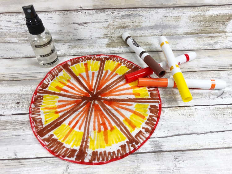 Step one of the turkey craft for kids - color with markers on the coffee filter... full instructions for this tie dye turkey on DearCreatives.com