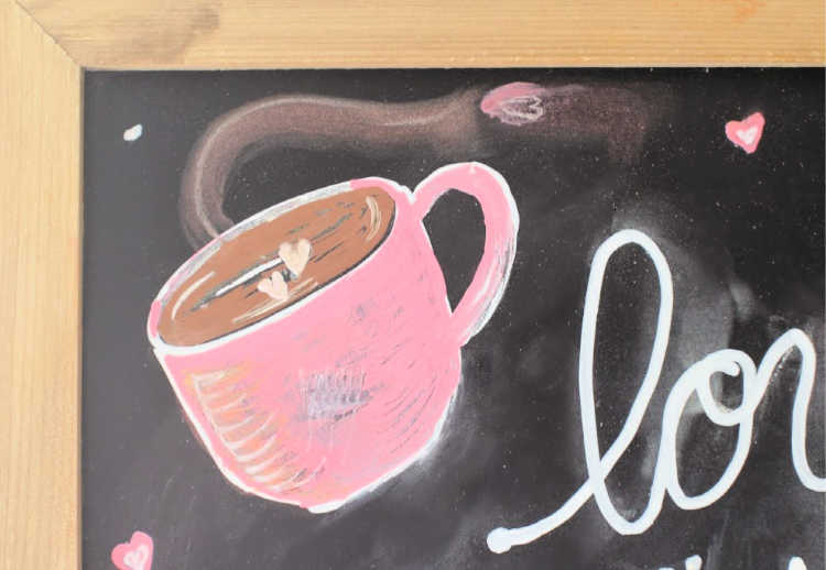 Close up of part of a chalkboard art spring with a coffee cup, hearts, flowers and a coffee quote...See how to make your own chalkboard crafts.© DearCreatives.com
