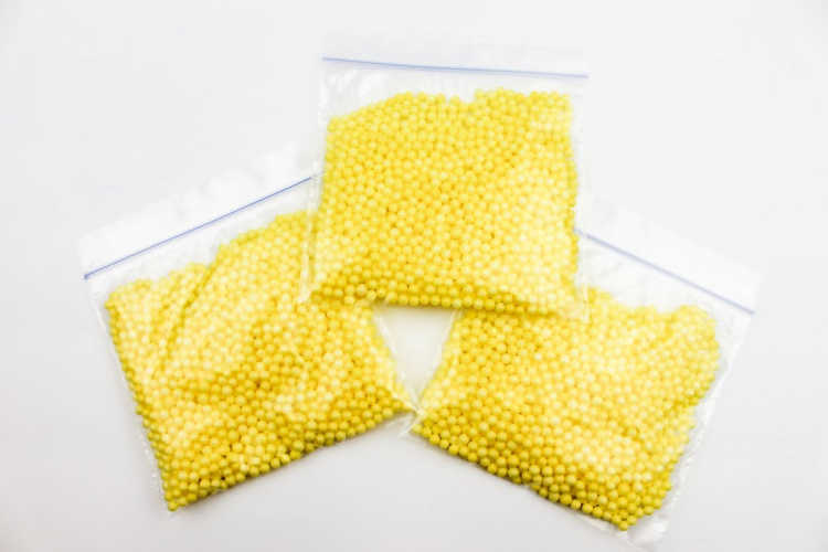 Foam beads added to a plastic bag for a kids butterfly craft. Grab the full instructions at DearCreatives.com