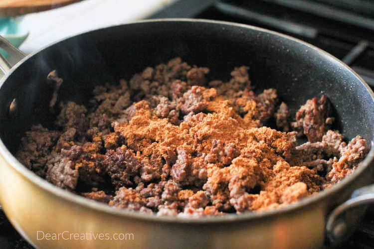 Ground beef with seasonings for taco potatoes. © DearCreatives.com