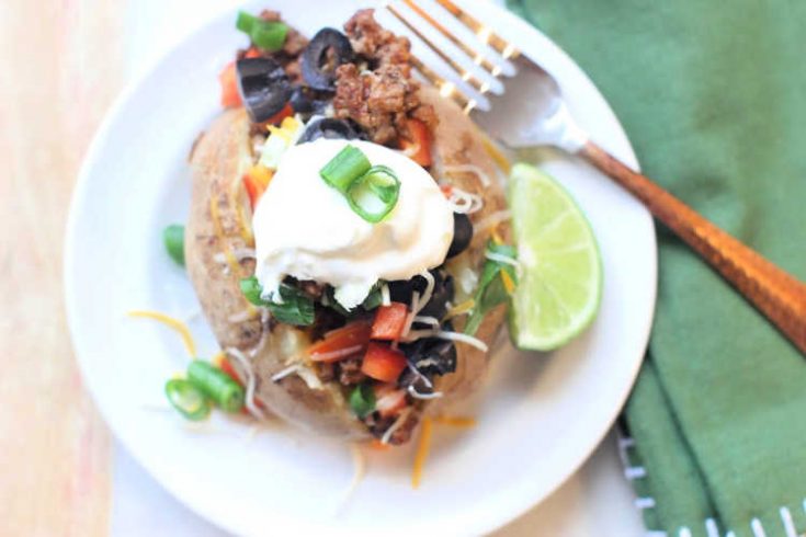 Switch up your taco Tuesday with Taco Potatoes - Easy delicious, and topped with your favorite taco toppings. Directions for from scratch and from a seasoning packet. © DearCreatives.com
