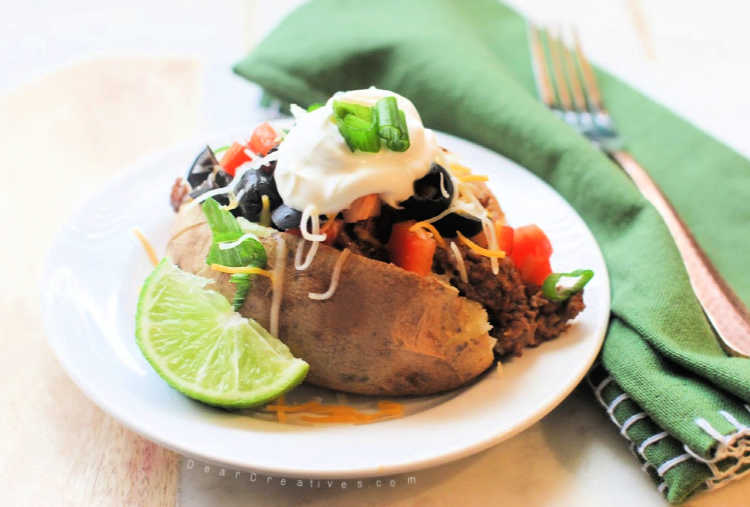 Taco Potato ready to be eaten. This is the best taco potatoes recipe, easy, tasty and tips for making it from scratch or quickly.© DearCreatives.com