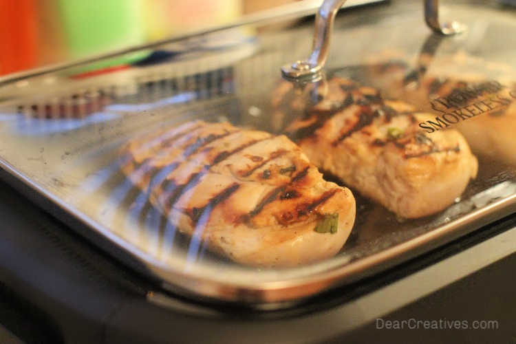 grilled chicken on an indoor grill with the lid on it. See how to cook grilled chicken with marinade on the grill or indoor grill - - © DearCreatives.com