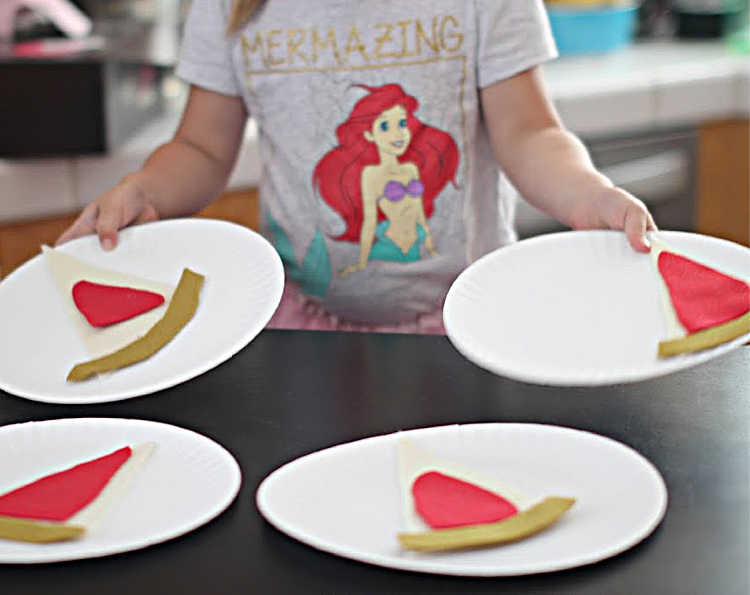 Felt Pizza - Felt Craft For Kids - little girl making pizza with felt - templates for toppings and instructions at DearCreatives.com