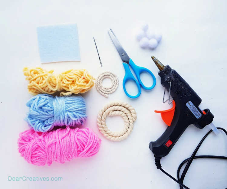 Craft supplies you will need for making a macrame rainbow wall hanging - DearCreatives.com