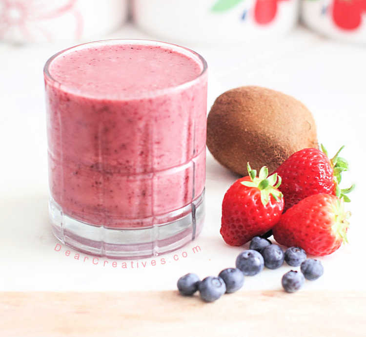 Fruit Smoothies In Plastic Cups With Blueberry, Strawberry, Kiwi