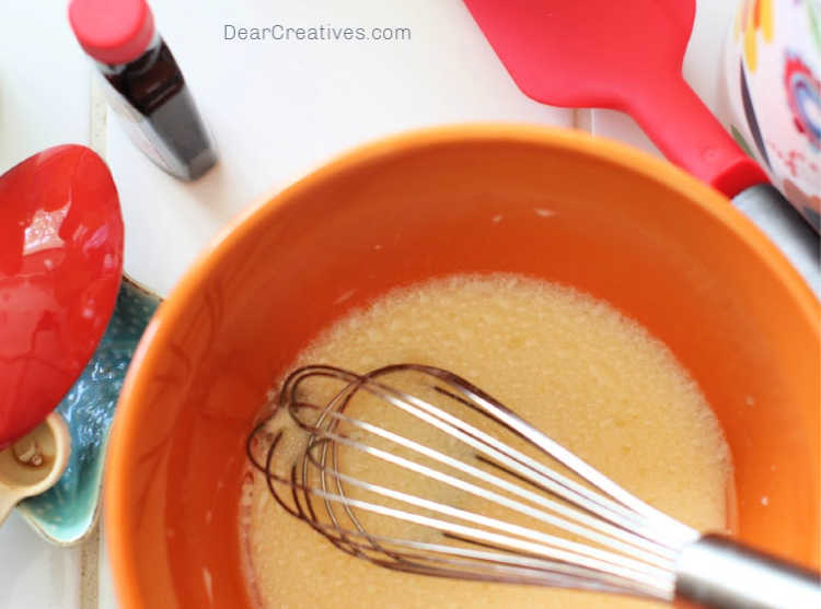 mixing egg, oil, vanilla extract...for making a recipe for blueberry bread - © DearCreatives.com