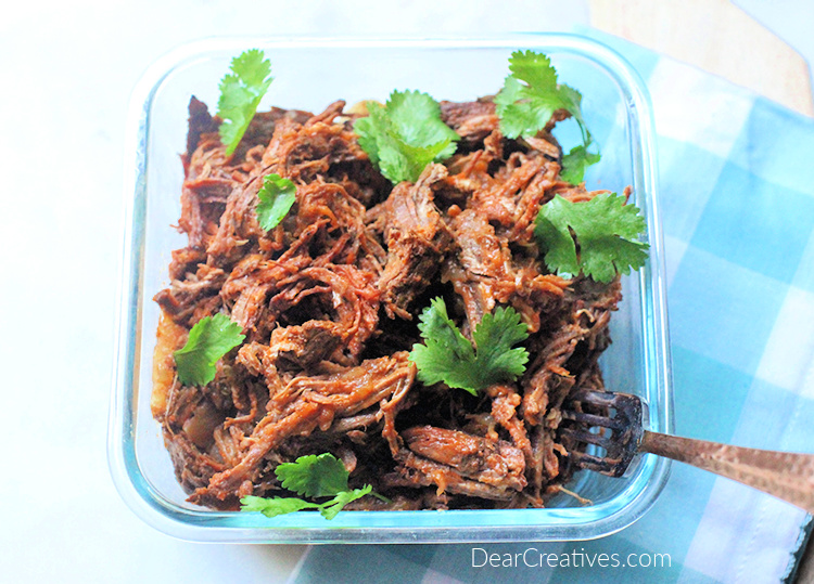 Beef barbacoa - Shredded beef cooked and ready to use in salads, tacos, burritos and other recipes. Get the beef barbacoa recipe - © DearCreatives.com