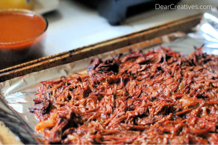 Beef barbacoa that just finished cooking Grab the recipe at DearCreatives.com