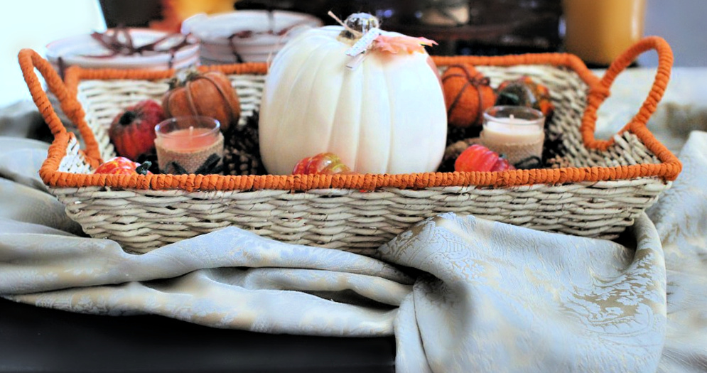 Basket on table with large pumpkin and fall decorations - Thanksgiving decor ideas- DearCreatives.com