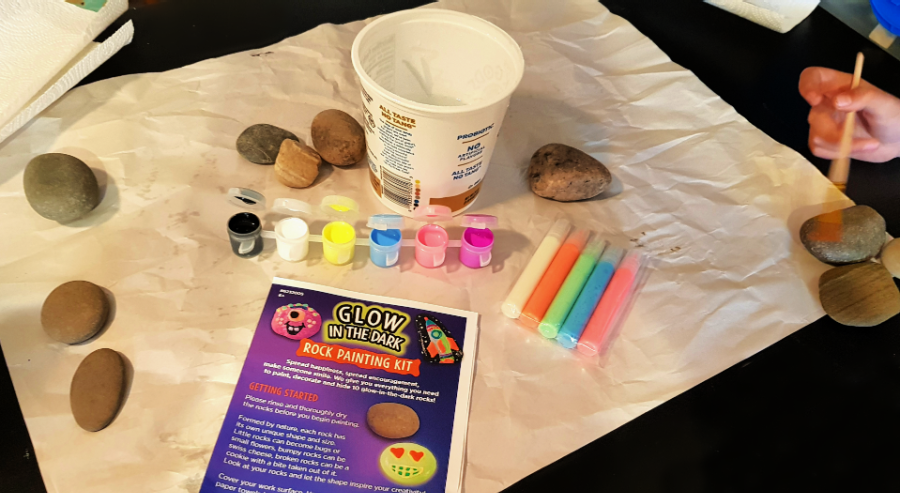 https://www.dearcreatives.com/wp-content/uploads/2021/03/Supplies-from-the-rock-painting-kit-paper-to-protect-the-table-paints-glow-paint-tubes-instructions-water-container-paintbrush...DearCreatives.com-.png