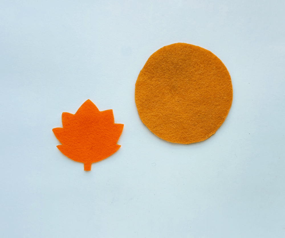 DIY Leaf Coaster - Step (1). Select 2 different colored felt fabrics for the maple leaf coaster...