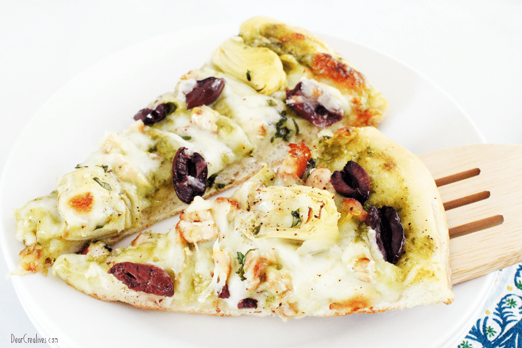Easy Pesto Pizza - Two slices of pesto pizza on a plate - Get the recipe at © DearCreatives.com