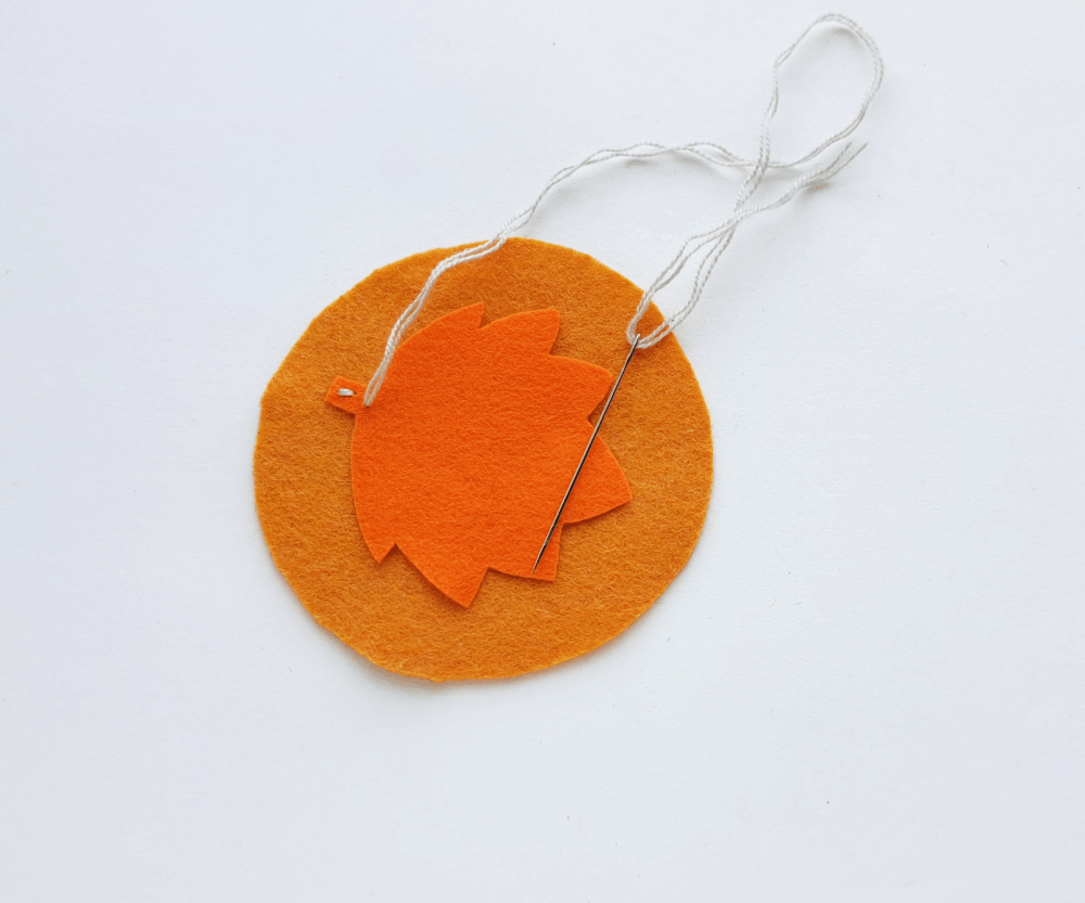 Felt Mug Rug Leaf Design - Coaster Steps (3). Start stitching from the bottom side of the maple leaf... DIY and felt crafts at DearCreatives.com