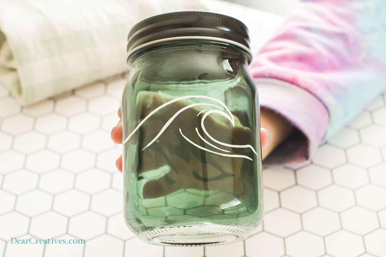 Cricut Jar Ideas - Jar with a wave design made with a Cricut machine and vinyl. DIY at © DearCreatives.com