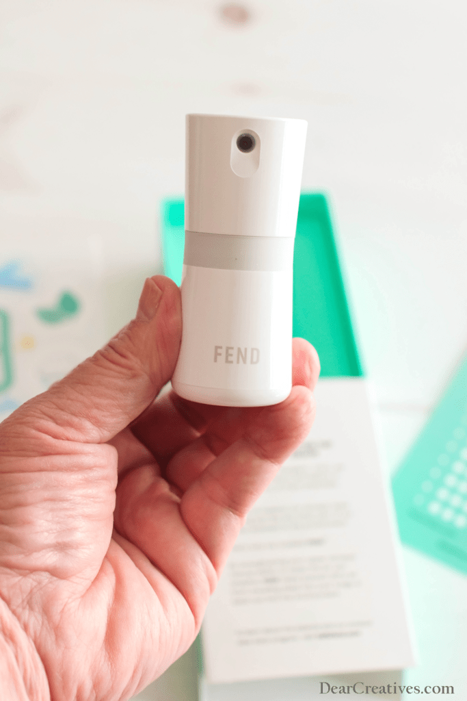 Holding FEND applicator in hand ©2022 DearCreatives.com