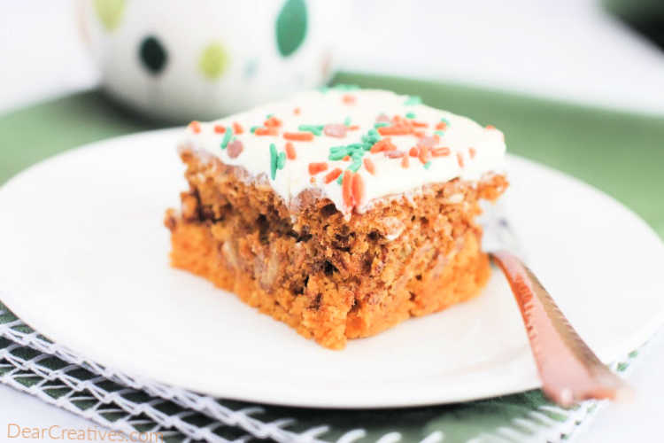 Pumpkin Dump Cake - The best fall cake that is so easy to make and a crowd-pleasing cake. Make it in a 13 x 9 size baking pan. Using a cake mix and pantry ingredients make this delicious pumpkin dump cake topped with frosting and sprinkles... DearCreatives.com